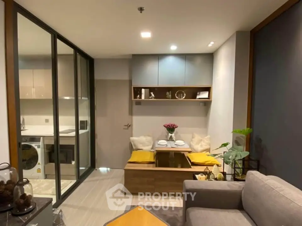 Modern living room with cozy dining nook and open kitchen layout