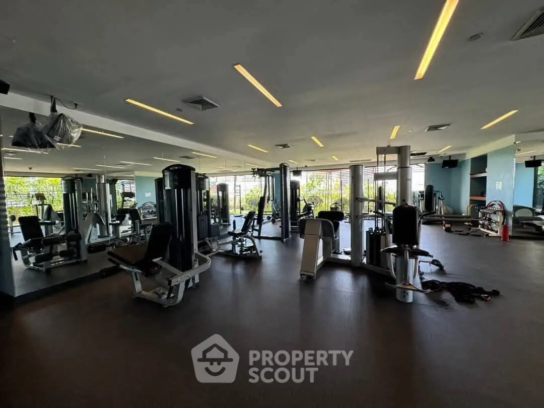 Spacious modern gym with state-of-the-art equipment and large mirrors
