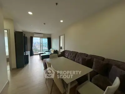 Spacious living room with modern furniture and city view