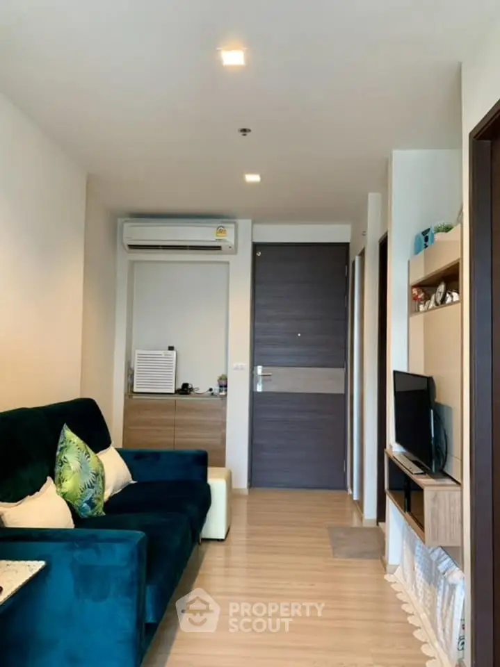 Modern living room with stylish decor and air conditioning in a cozy apartment.