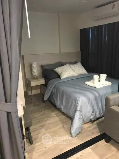 Cozy modern bedroom with stylish decor and comfortable bedding