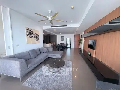 Spacious modern living room with sleek furniture and open layout