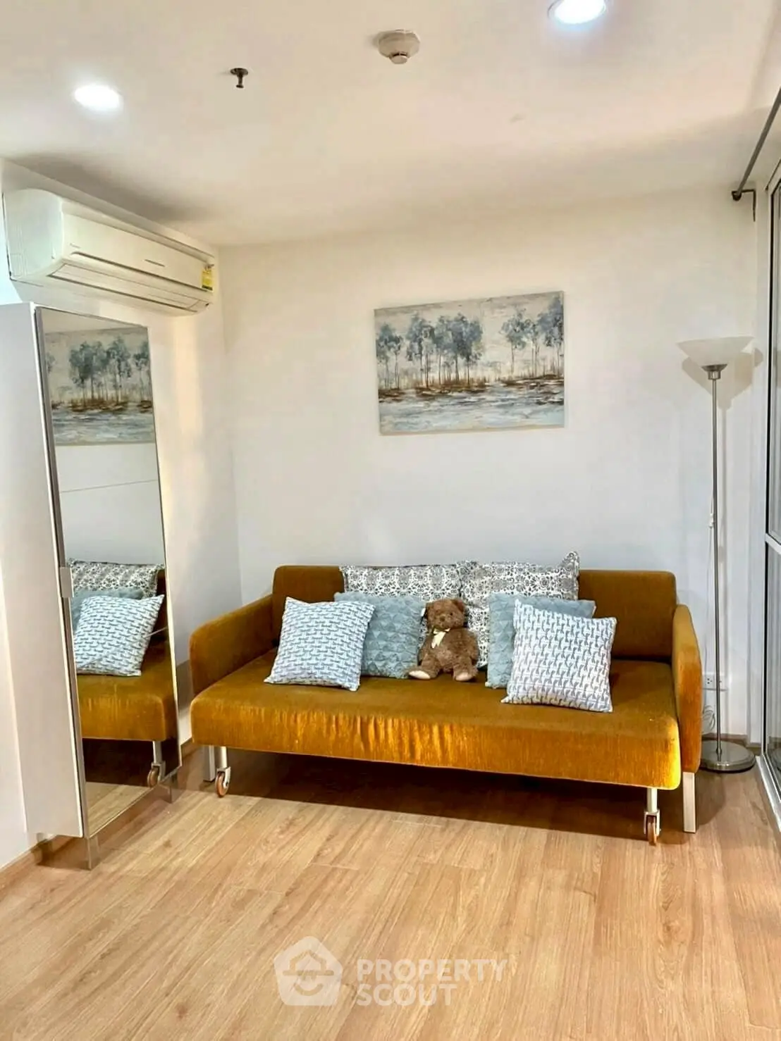 Cozy living room with mustard sofa and modern decor