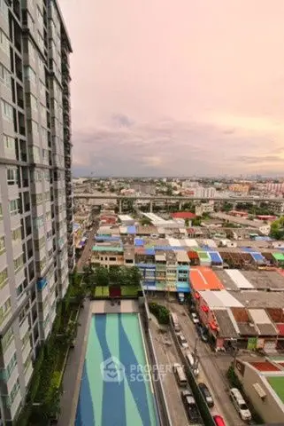Stunning cityscape view from high-rise building with pool, perfect urban living.