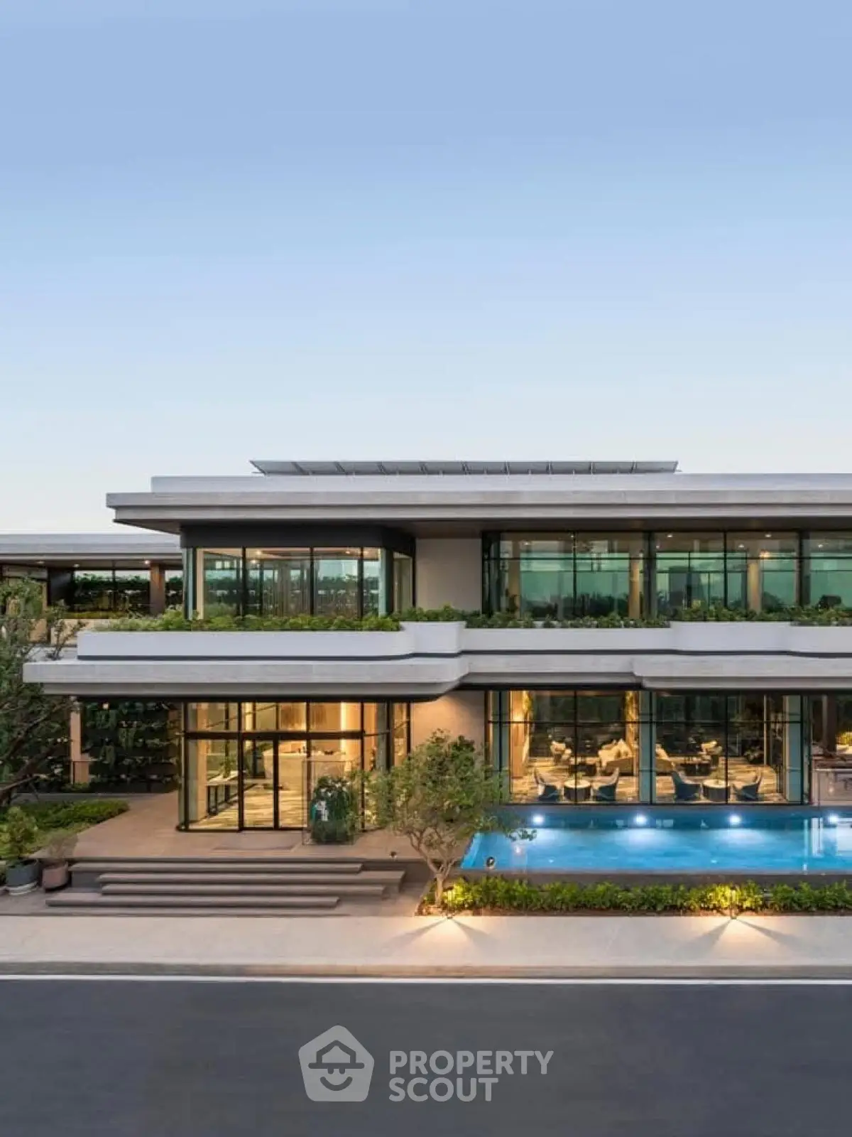 Luxurious modern villa with expansive glass windows and private pool