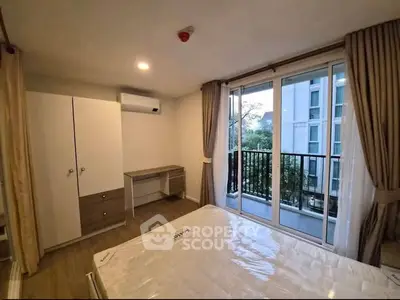 Modern bedroom with balcony view in a stylish apartment