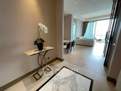 Luxurious open-layout living room with elegant decor and natural light