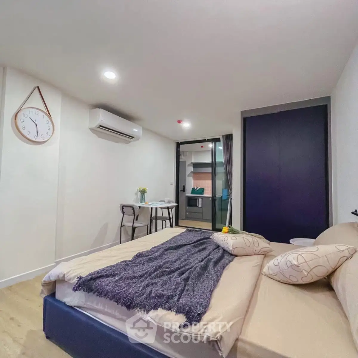 Modern bedroom with cozy decor and stylish furniture in a contemporary apartment.