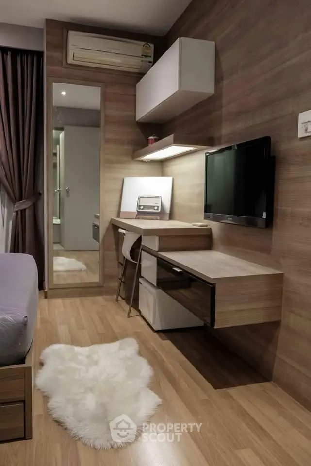 Modern bedroom with sleek workspace and cozy decor