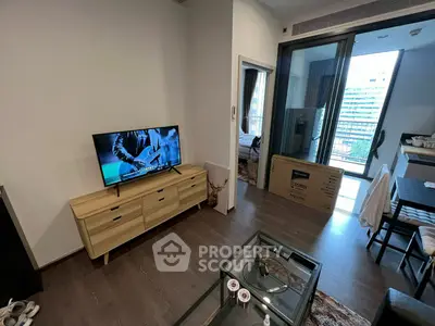 Modern living room with sleek furniture and balcony view in urban apartment