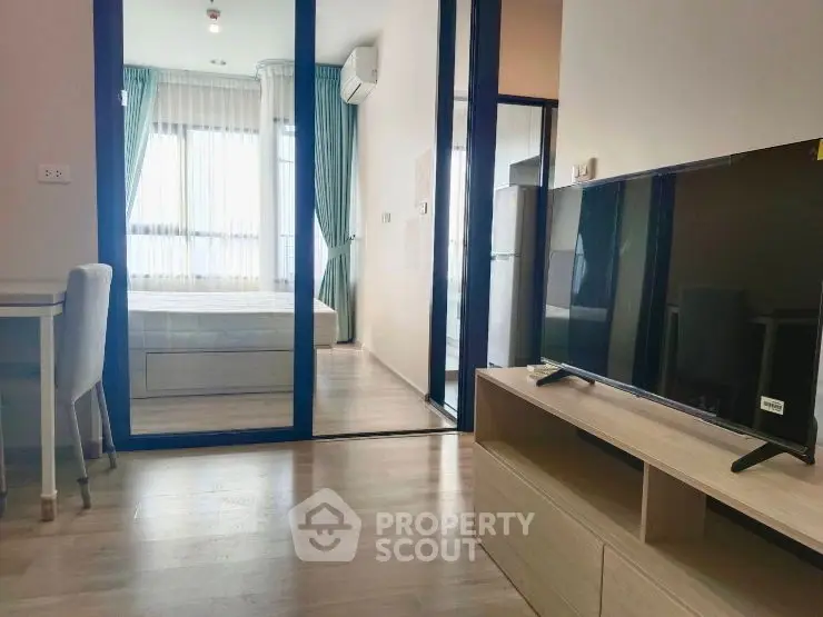 Modern living room with sleek design and abundant natural light