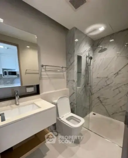 Modern bathroom with sleek design and glass shower enclosure