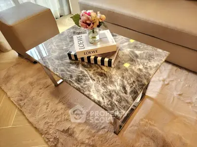 Elegant living room with marble coffee table and plush rug, perfect for modern interiors.