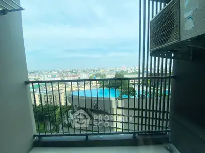 Stunning balcony view with cityscape and pool, perfect for urban living.