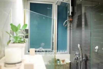 Modern bathroom with glass shower and stylish fixtures
