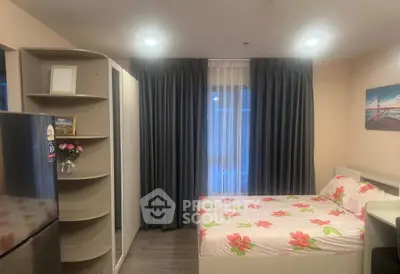 Cozy bedroom with floral bedding and modern decor in a stylish apartment.