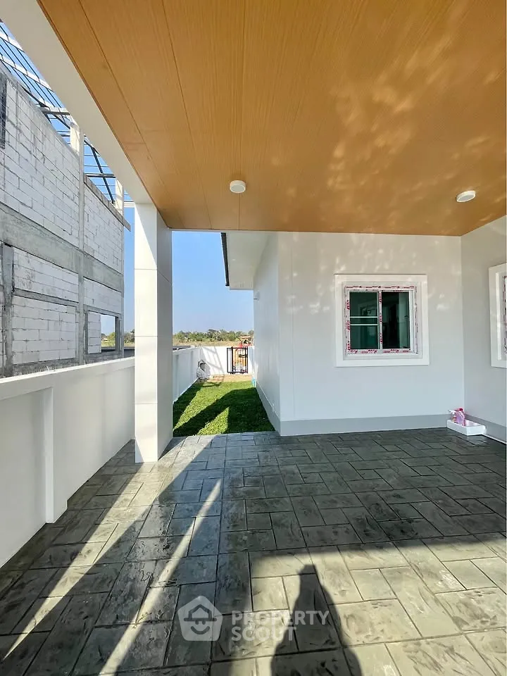 Modern home exterior with spacious patio and stylish design