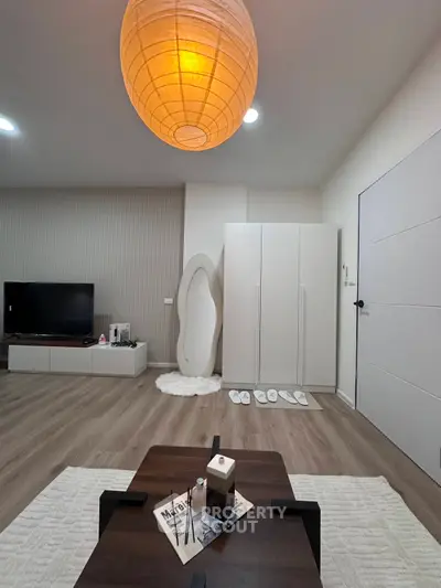 Modern living room with stylish decor and ambient lighting