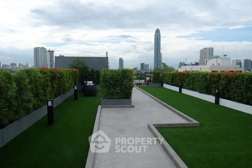 Stunning rooftop garden with city skyline views and lush greenery.