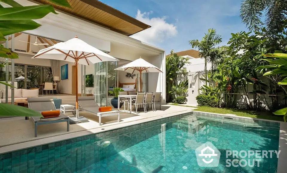 Luxurious villa with private pool and lush garden, perfect for tropical living.