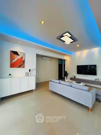 Modern living room with sleek design, ambient lighting, and stylish furniture for a contemporary lifestyle.