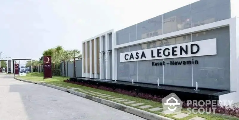 Modern entrance of Casa Legend Kaset Nawamin with sleek design and lush landscaping.