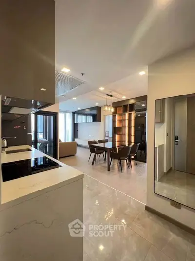 Modern open-layout apartment with sleek kitchen and spacious living area