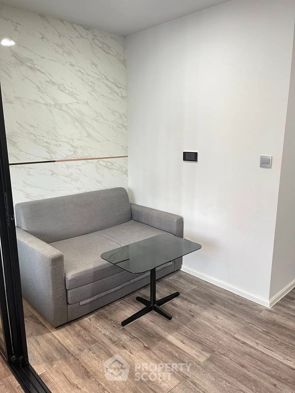 Cozy modern living area with sleek sofa and stylish coffee table