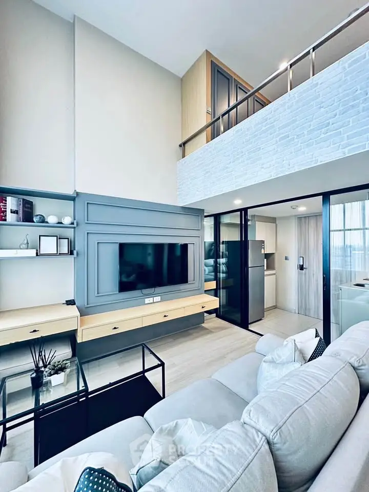 Modern loft-style living room with high ceilings and sleek design