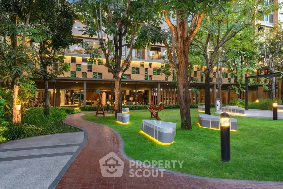 Lush garden area with modern seating in a residential complex