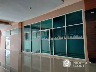 Spacious commercial property with modern glass facade and polished flooring