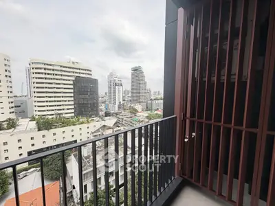 Stunning city view from modern balcony in high-rise apartment