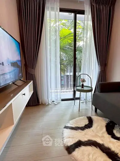 Chic living room with modern decor and balcony view, perfect for relaxation and entertainment.