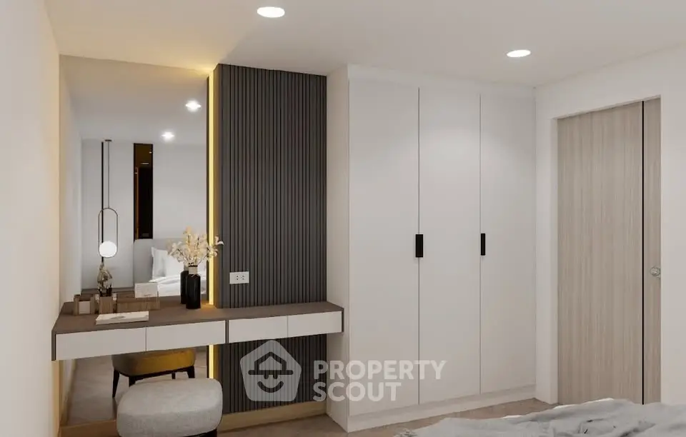 Modern bedroom with sleek built-in wardrobe and stylish vanity area