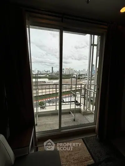 Stunning city view from a cozy apartment balcony, perfect for urban living.