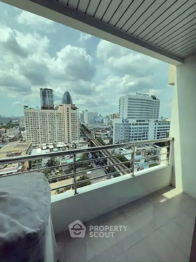Stunning cityscape view from a high-rise balcony, perfect for urban living enthusiasts.