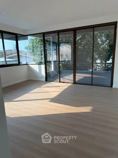 Spacious corner unit with large windows and balcony, offering abundant natural light and serene views.