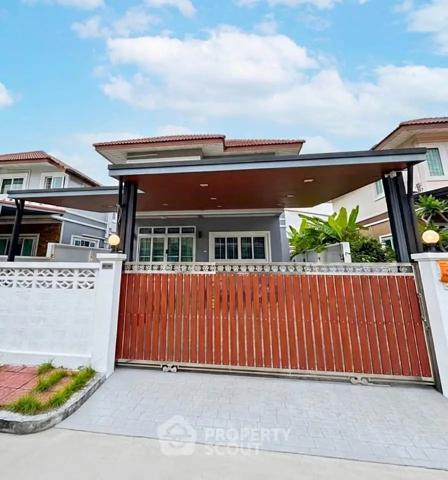 Charming suburban house with modern design and spacious driveway, perfect for family living.