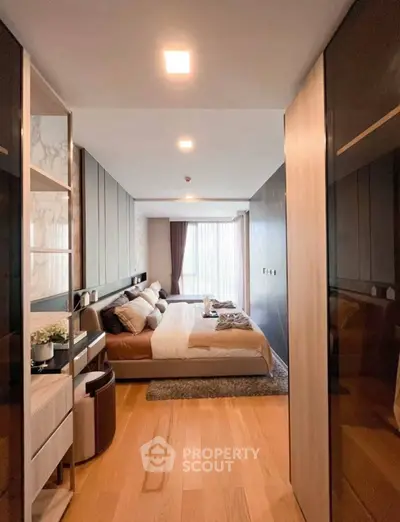 Luxurious bedroom with modern design and large window offering natural light.
