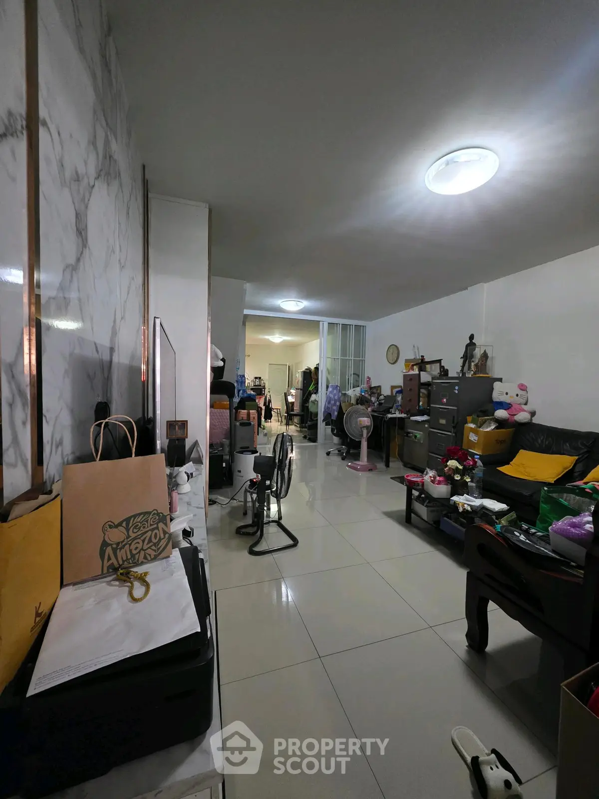 Spacious living room with modern decor and ample natural light