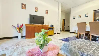 Spacious living room with modern decor and entertainment center