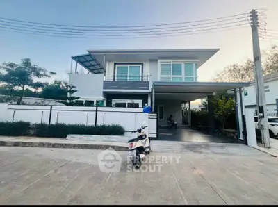 Modern two-story house with spacious driveway and sleek design