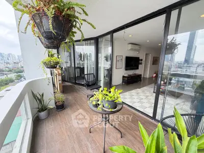 Spacious balcony with city view and modern interior, perfect for urban living.