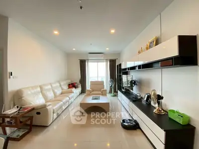 Spacious modern living room with sleek furniture and natural light