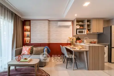 Modern open-plan living room and kitchen with stylish decor and natural light.