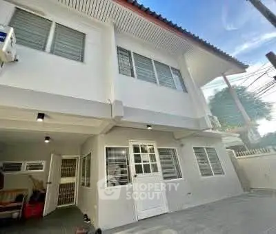 Spacious two-story house exterior with modern design and ample windows.