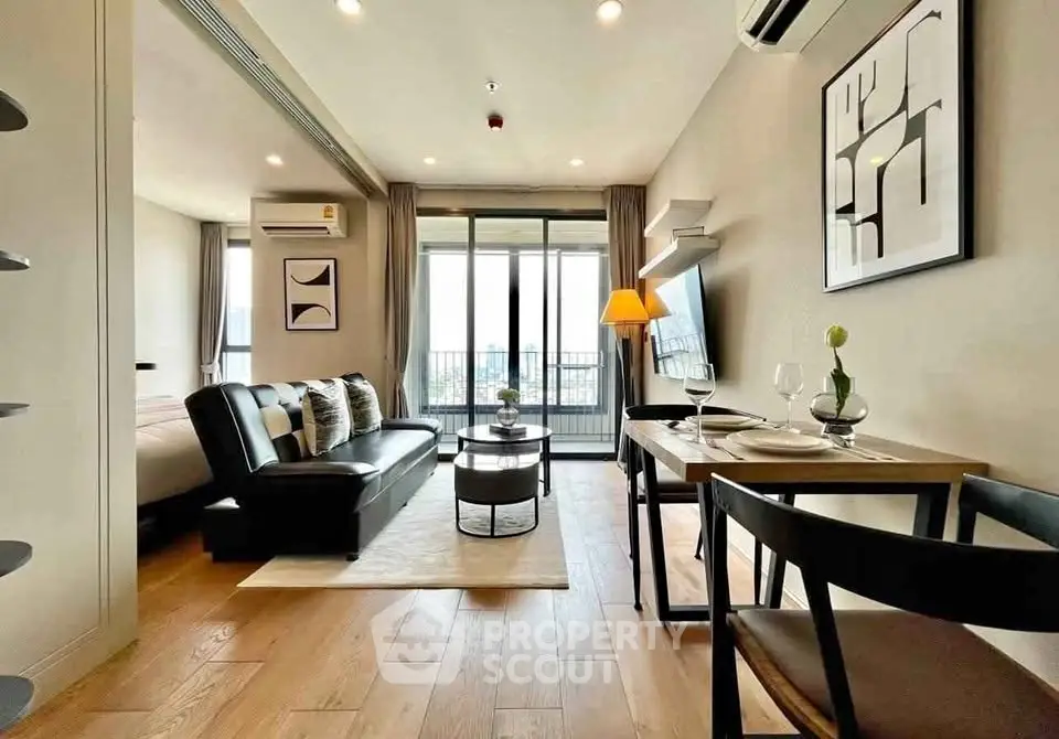 Modern open-plan living room with stylish decor and balcony view in a contemporary apartment.