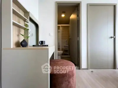 Modern apartment interior with stylish furniture and bathroom view, perfect for urban living.