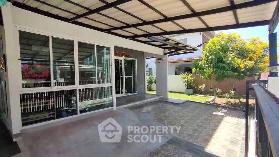 Charming modern home with spacious carport and lush garden, perfect for family living.