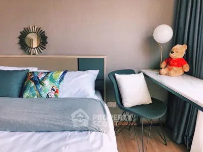 Cozy bedroom with stylish decor and natural light, featuring a plush bed and modern furnishings.